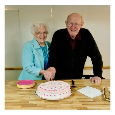 Bob and Jean cutting a cake